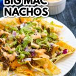 Closeup of a plate of Big Mac nachos with the special sauce in the background and text overlay.
