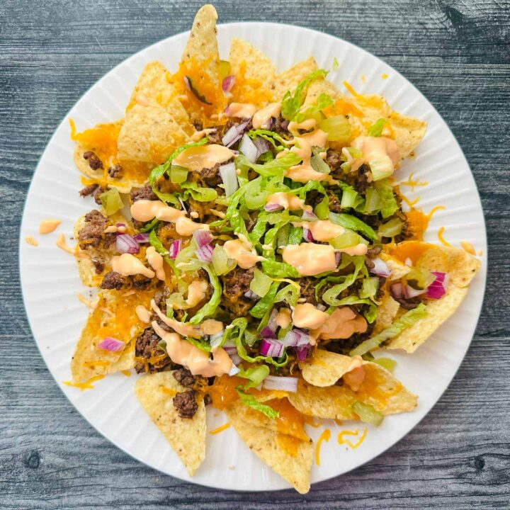 Aerial view of a white plate with the Big Mac nachos.