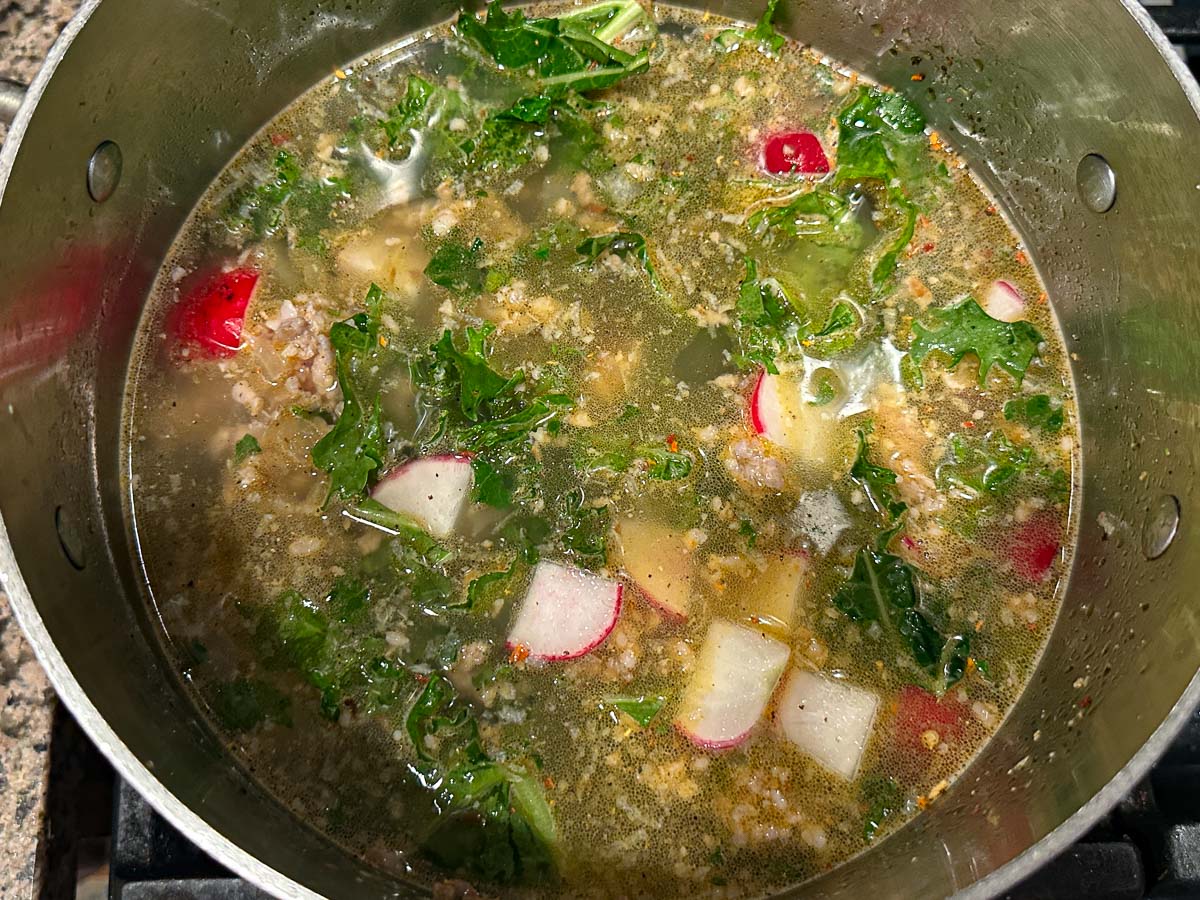 Pot with all the soup ingredients added excess cauliflower cream.