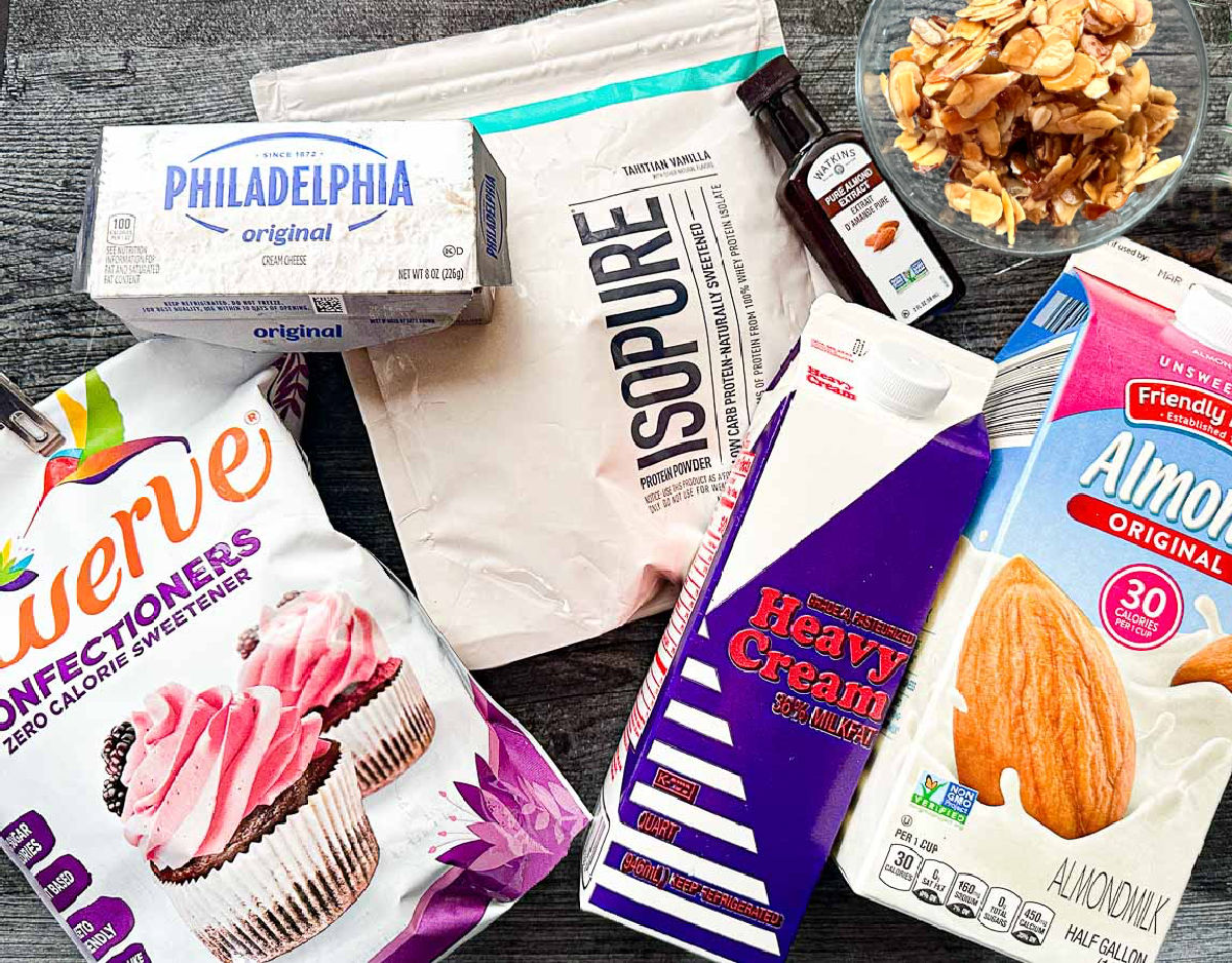 Recipe ingredients - heavy cream, cream cheese, heavy cream, Swerve sweetener, almond extract, Isopure protein powder and toasted almond slivers.