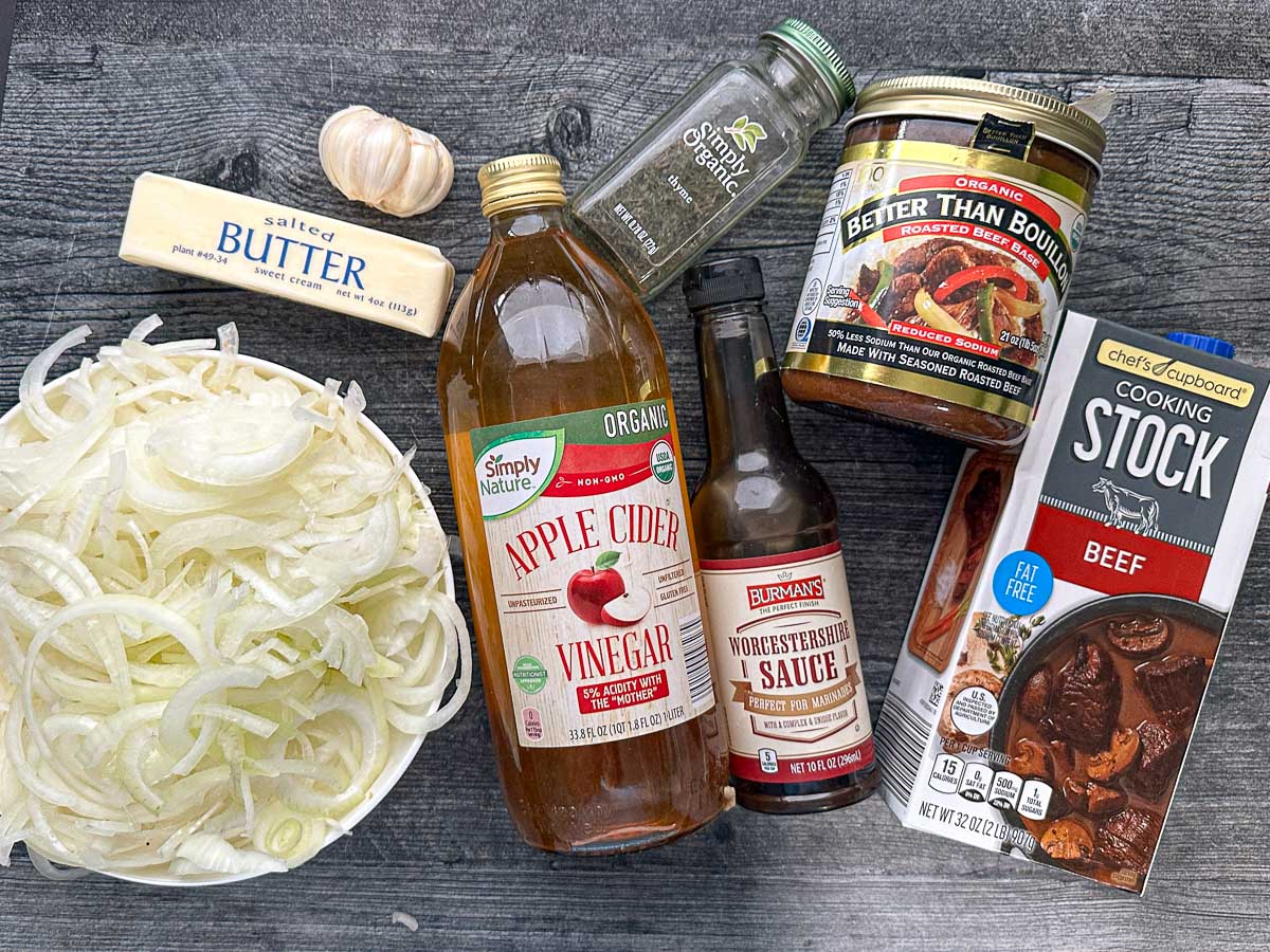 Recipe ingredients - sliced onions, butter, garlic, vinegar, Worcestershire sauce, thyme, broth and Better that Bouillon.