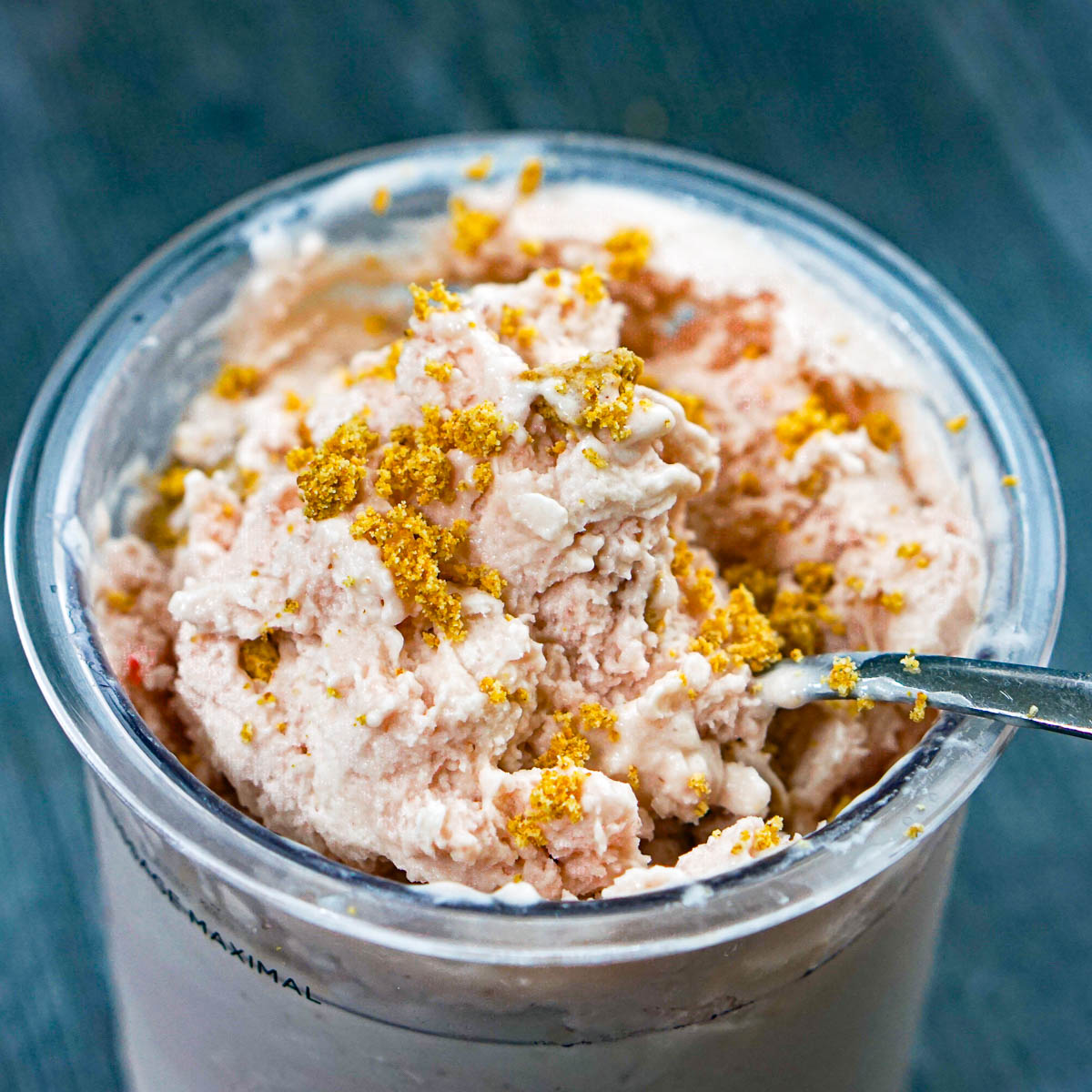 Closeup of a container of Ninja Creami strawberry cheesecake ice cream that's low carb and sugar free.