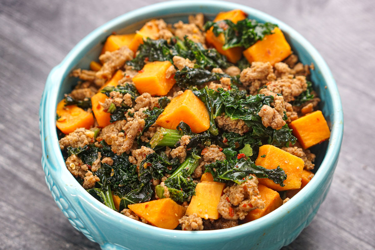 Closeup of a blue bowl with the finished recipe.