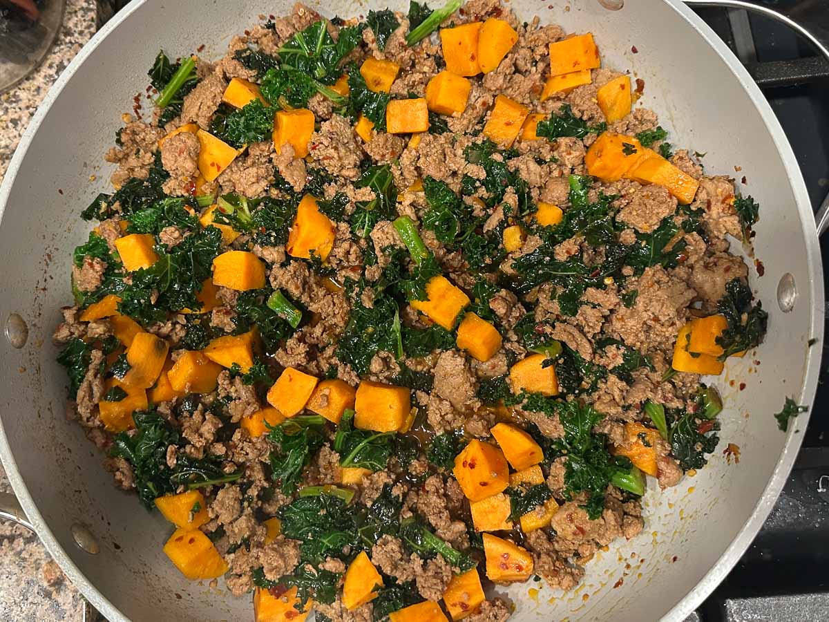 Skillet with the finished sweet potato mixture.
