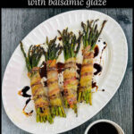 Aerial view of white platter with a 4 bacon wrapped asparagus bundles with balsamic glaze and text overlay.