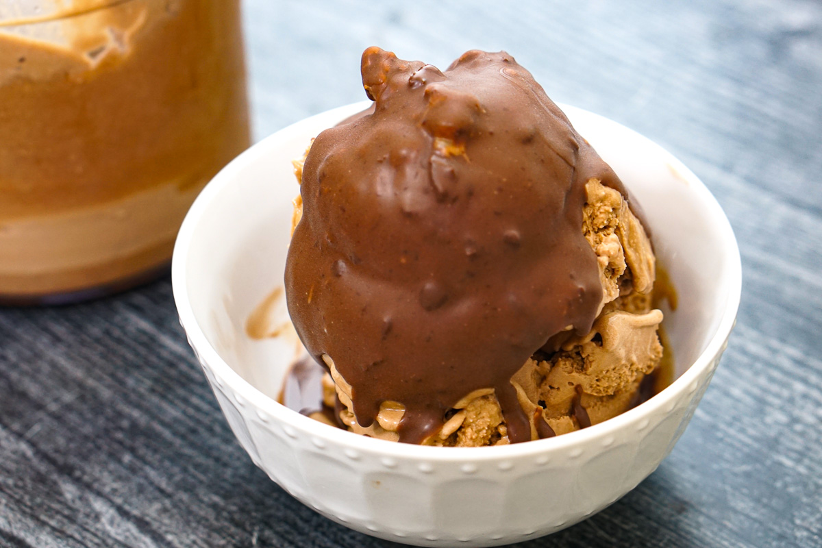 Closeup of a dish of the coffee ice cream with homemade magic shell poured over top.