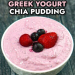White bowl with the low carb yogurt chia seed pudding with a few berries on top and text.