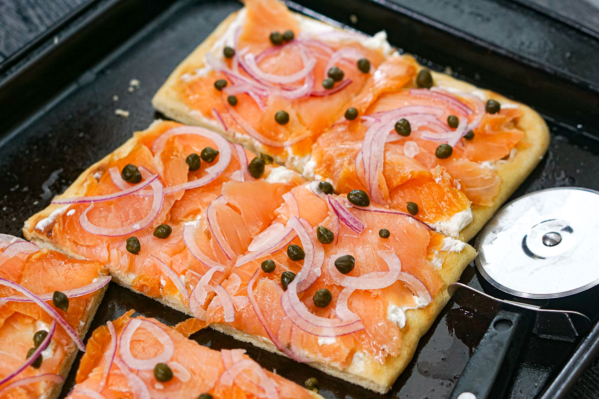 Closeup of the baking sheet with the cut pieces of flatbread.